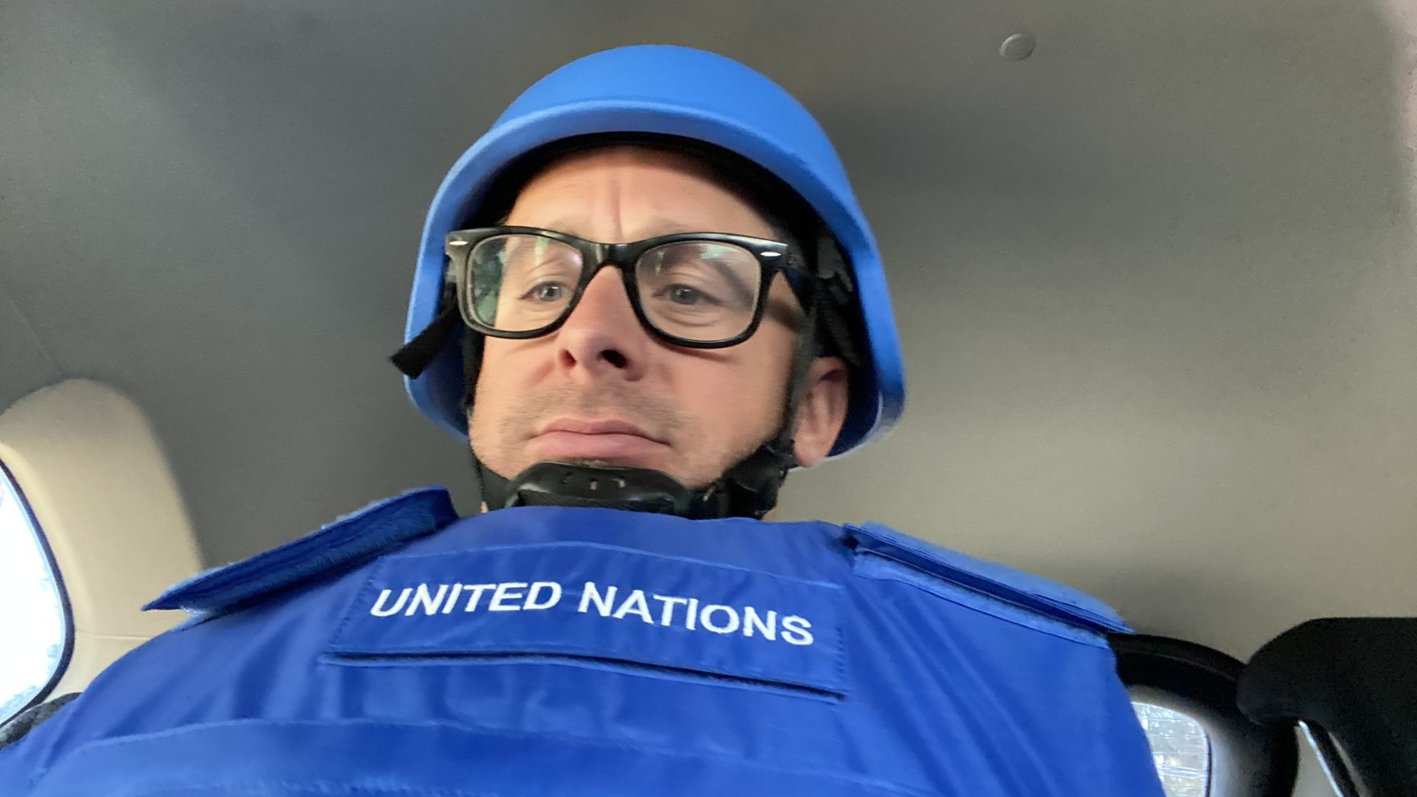 George Willcoxon in United Nations helmet and protective vest during security training